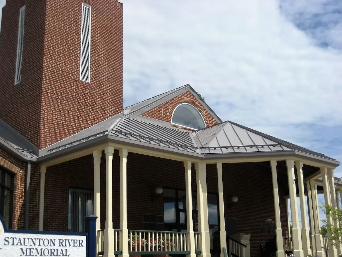 Skilled roofing craftsmen working on a residential roof in Wellsville